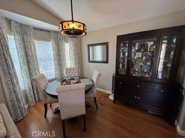 2 Via Pariente, Rancho Santa Margarita, CA 92688 - dining space featuring lofted ceiling, wood finished floors, and baseboards