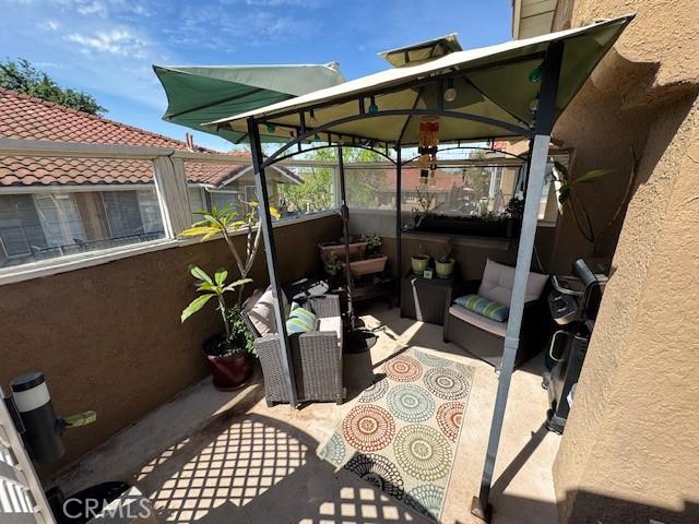 2 Via Pariente, Rancho Santa Margarita, CA 92688 - view of patio featuring a gazebo, fence, and an outdoor hangout area
