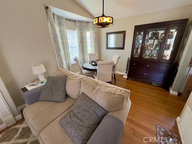 2 Via Pariente, Rancho Santa Margarita, CA 92688 - dining room featuring wood finished floors, baseboards, and lofted ceiling