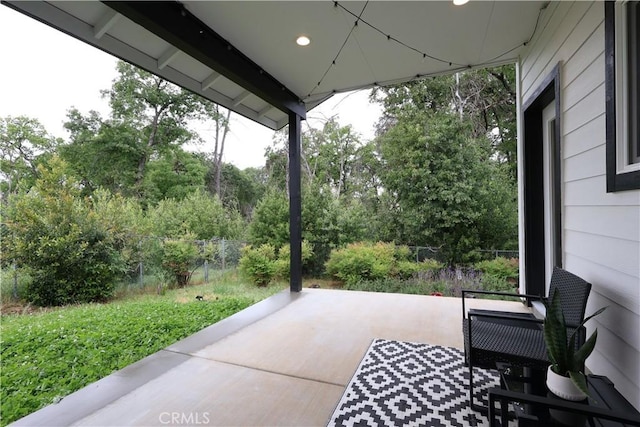 view of patio / terrace featuring fence