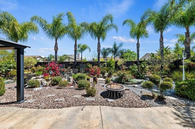 view of patio / terrace with a fire pit and a fenced backyard