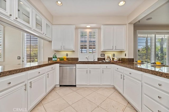 kitchen with dishwasher, white cabinetry, and recessed lighting