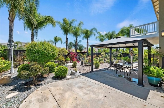 view of patio / terrace featuring a fenced backyard and a gazebo