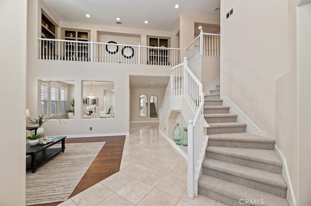 interior space with baseboards and recessed lighting