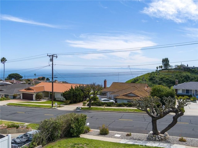 view of road with curbs and sidewalks