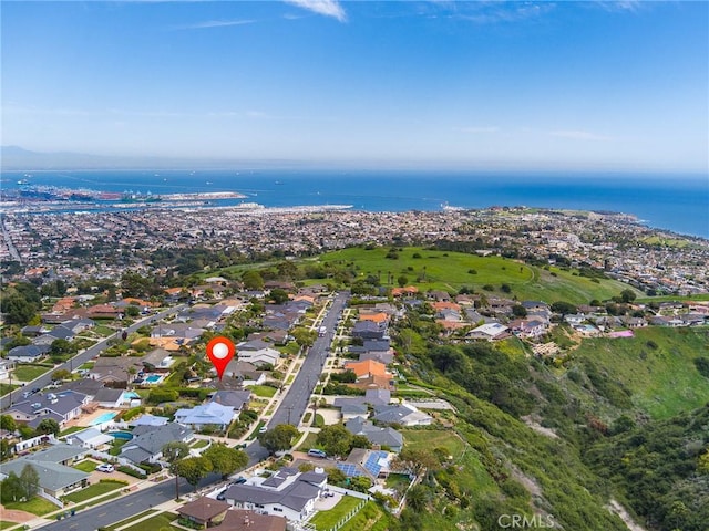 birds eye view of property with a water view and a residential view