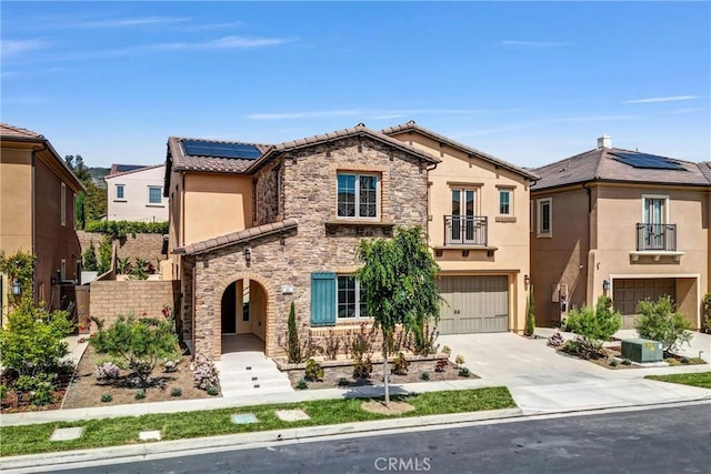63 Poncho, Irvine, CA 92602 - view of front of house with a garage, stucco siding, stone siding, driveway, and a tiled roof
