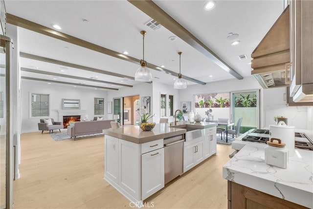 63 Poncho, Irvine, CA 92602 - kitchen with dishwasher, a sink, beam ceiling, light wood-style floors, and white cabinetry