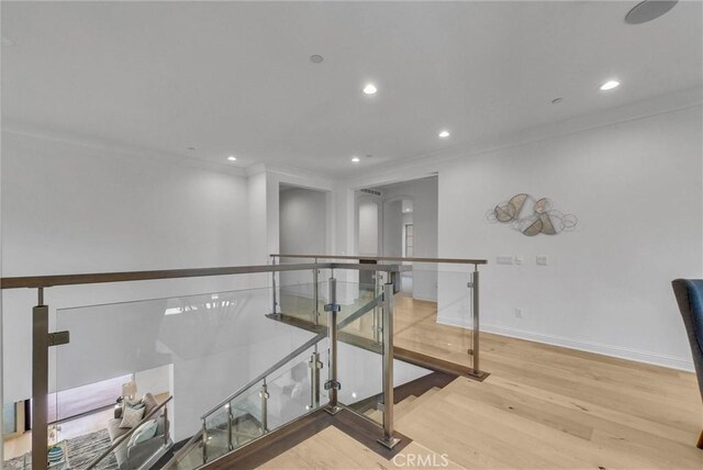 63 Poncho, Irvine, CA 92602 - corridor featuring an upstairs landing, wood finished floors, recessed lighting, baseboards, and ornamental molding
