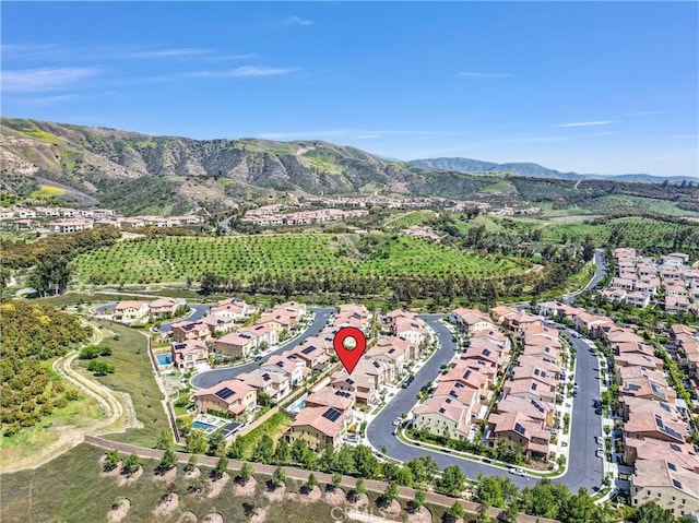 63 Poncho, Irvine, CA 92602 - aerial overview of property's location with mountains and nearby suburban area