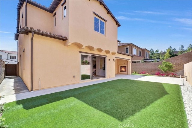 63 Poncho, Irvine, CA 92602 - rear view of property with a patio area and stucco siding