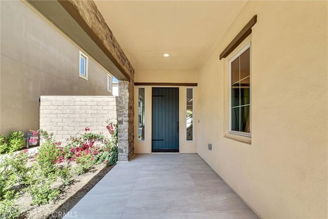 63 Poncho, Irvine, CA 92602 - entrance to property featuring stucco siding and a patio area