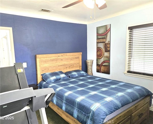 bedroom featuring a ceiling fan and visible vents