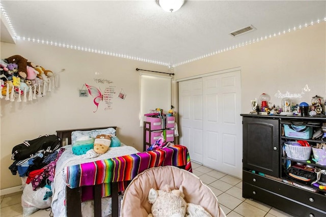 10517 50th St, Jurupa Valley, CA 91752 - bedroom featuring visible vents, a closet, and light tile patterned floors
