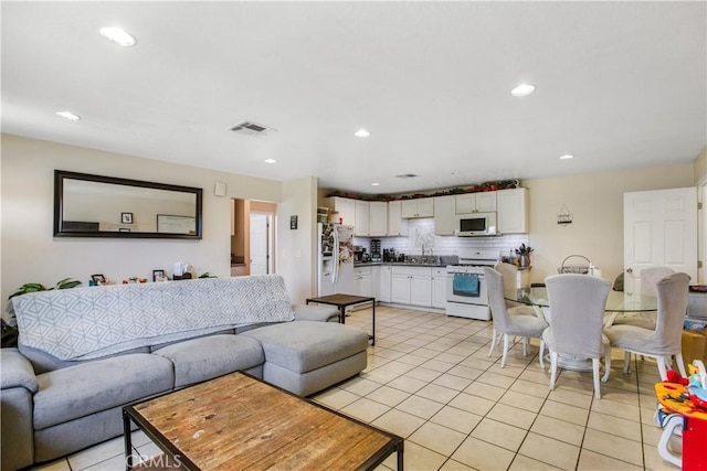 10517 50th St, Jurupa Valley, CA 91752 - living room with visible vents, recessed lighting, and light tile patterned floors