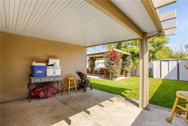 10517 50th St, Jurupa Valley, CA 91752 - view of patio / terrace featuring a shed, fence, and an outbuilding