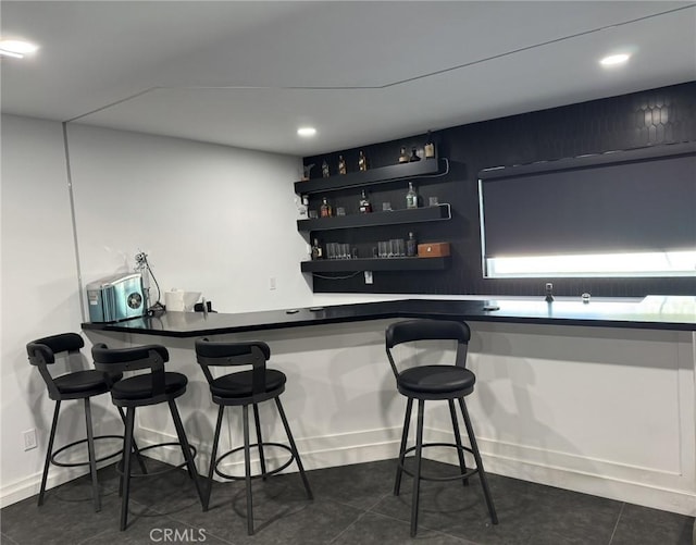 13771 Wawona Rd, Apple Valley, CA 92307 - indoor wet bar featuring dark tile patterned floors, recessed lighting, and baseboards