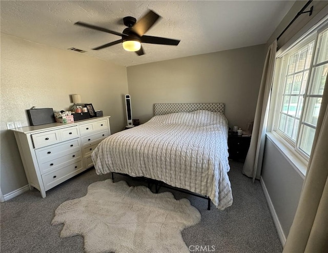 13771 Wawona Rd, Apple Valley, CA 92307 - bedroom featuring dark colored carpet, a textured ceiling, ceiling fan, and baseboards