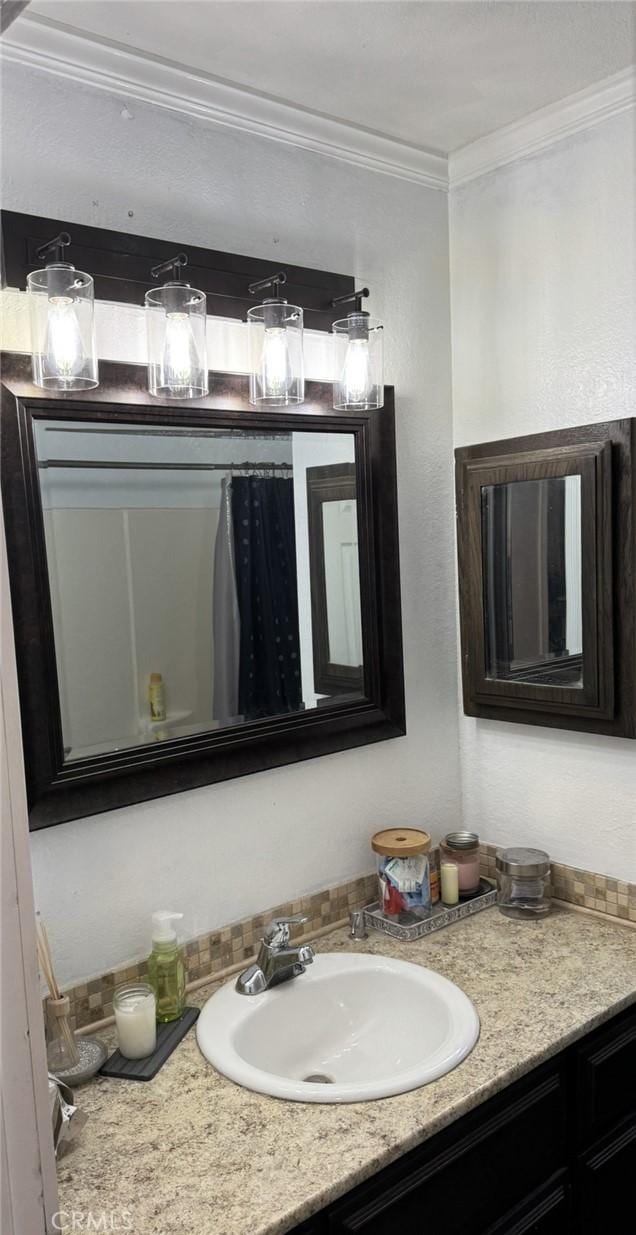 13771 Wawona Rd, Apple Valley, CA 92307 - bathroom featuring crown molding and vanity