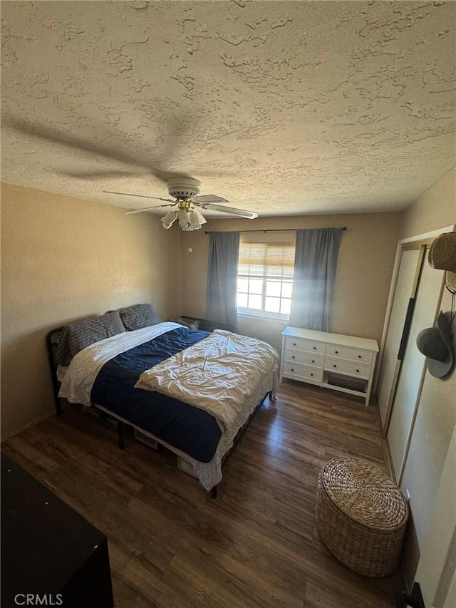 13771 Wawona Rd, Apple Valley, CA 92307 - bedroom with a textured ceiling, wood finished floors, and a ceiling fan
