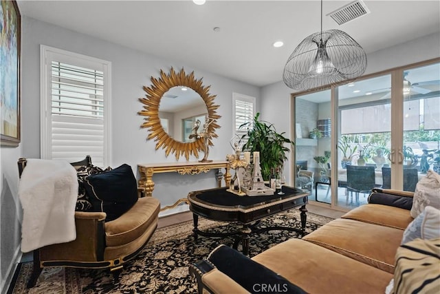 living room with french doors, recessed lighting, and visible vents