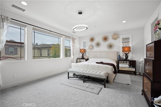 carpeted bedroom featuring baseboards, recessed lighting, and visible vents