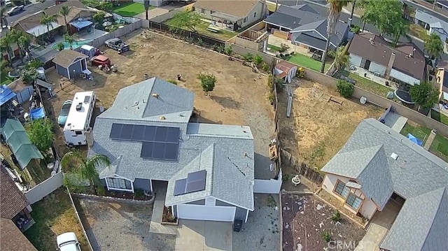 birds eye view of property with a residential view