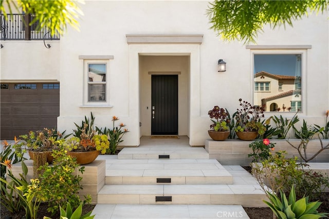 property entrance with stucco siding