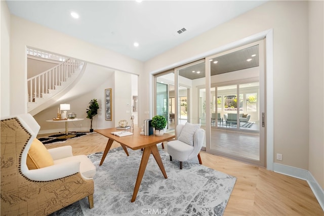 living area with baseboards, stairs, visible vents, and recessed lighting