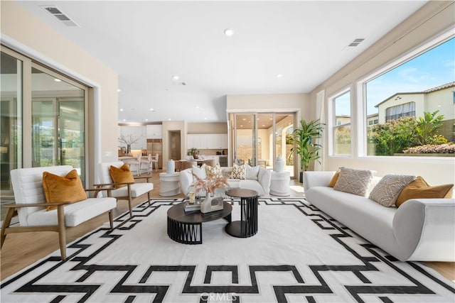living room with visible vents and recessed lighting
