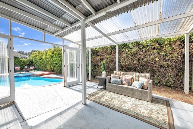 exterior space featuring a fenced in pool and an outdoor hangout area