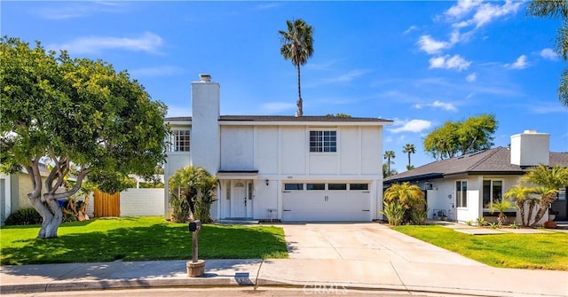 450 Anchor Way, Carlsbad, CA 92008 - traditional home featuring board and batten siding, driveway, an attached garage, and a chimney