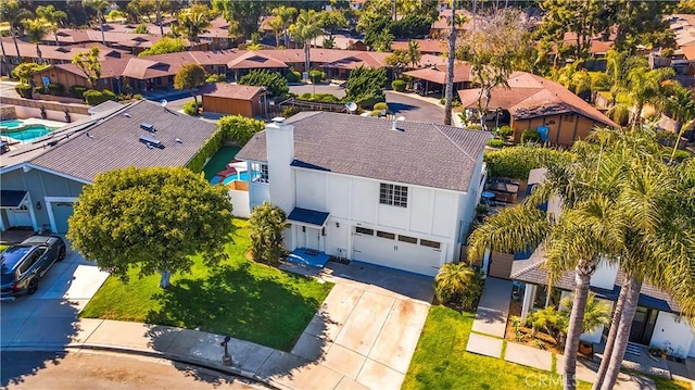 birds eye view of property with a residential view