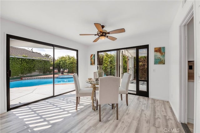 450 Anchor Way, Carlsbad, CA 92008 - dining room featuring healthy amount of natural light, light wood-style floors, ceiling fan, and baseboards