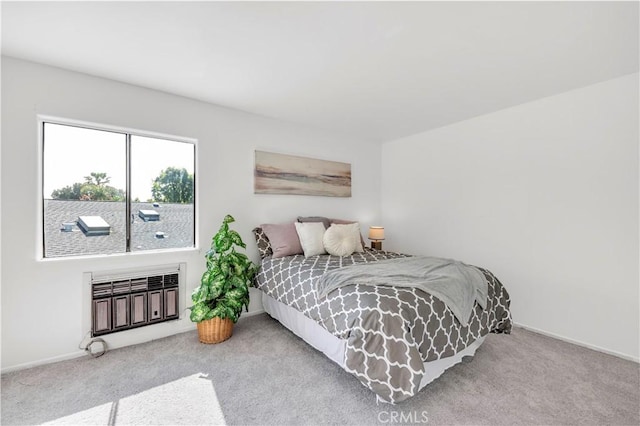bedroom featuring carpet floors and baseboards