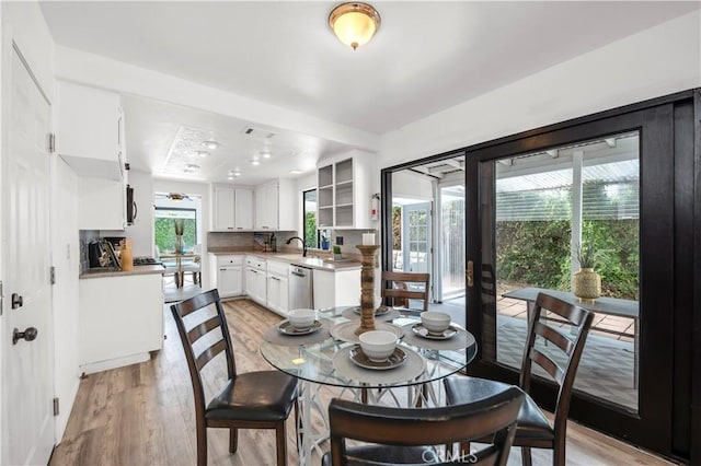 dining space featuring visible vents and light wood finished floors