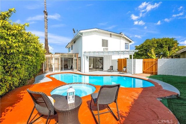 rear view of house with a pergola, a fenced in pool, a gate, a patio area, and fence private yard