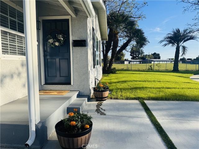 1260 S Pennsylvania, Glendora, CA 91740 - doorway to property with stucco siding and a lawn