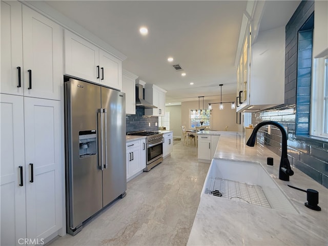 1260 S Pennsylvania, Glendora, CA 91740 - kitchen featuring premium appliances, backsplash, recessed lighting, light stone countertops, and white cabinetry