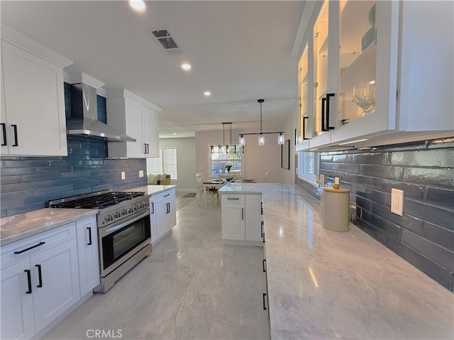 1260 S Pennsylvania, Glendora, CA 91740 - kitchen with stainless steel gas range, wall chimney exhaust hood, decorative backsplash, white cabinetry, and recessed lighting