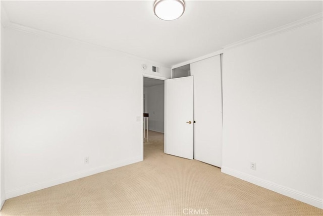 19 Alameda, Irvine, CA 92620 - unfurnished bedroom with light carpet, crown molding, visible vents, and baseboards