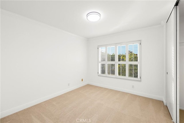 19 Alameda, Irvine, CA 92620 - empty room with light colored carpet, baseboards, and ornamental molding