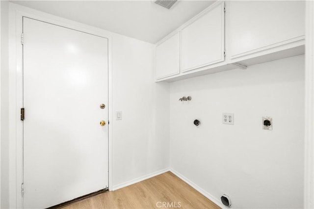 19 Alameda, Irvine, CA 92620 - laundry area featuring visible vents, hookup for an electric dryer, hookup for a washing machine, cabinet space, and light wood-style flooring