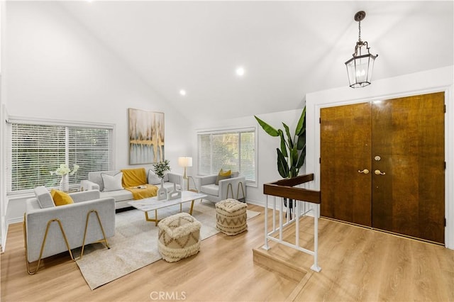19 Alameda, Irvine, CA 92620 - living area featuring baseboards, wood finished floors, recessed lighting, and high vaulted ceiling
