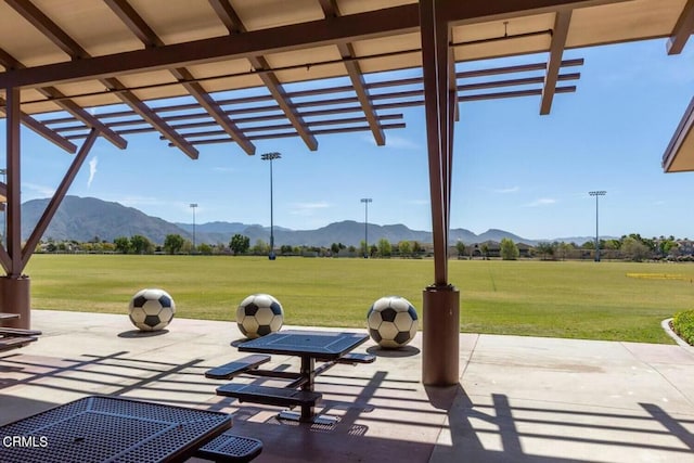 view of patio with a mountain view and a pergola