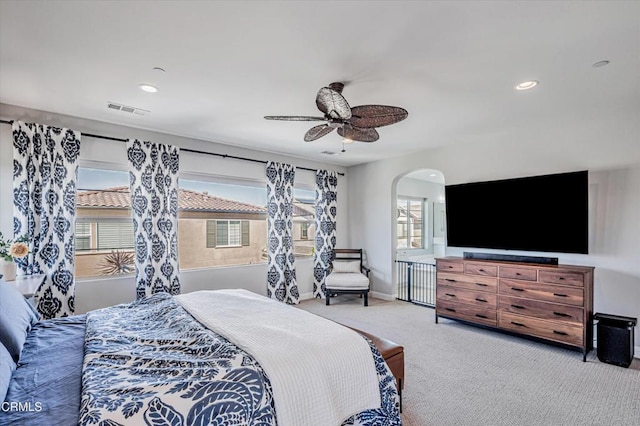 bedroom with recessed lighting, a ceiling fan, carpet floors, visible vents, and arched walkways