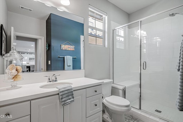 full bathroom featuring toilet, a stall shower, and visible vents