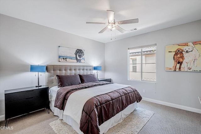 carpeted bedroom with baseboards, a ceiling fan, and visible vents