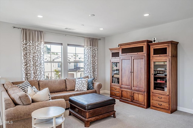 living room featuring recessed lighting, visible vents, light colored carpet, and baseboards