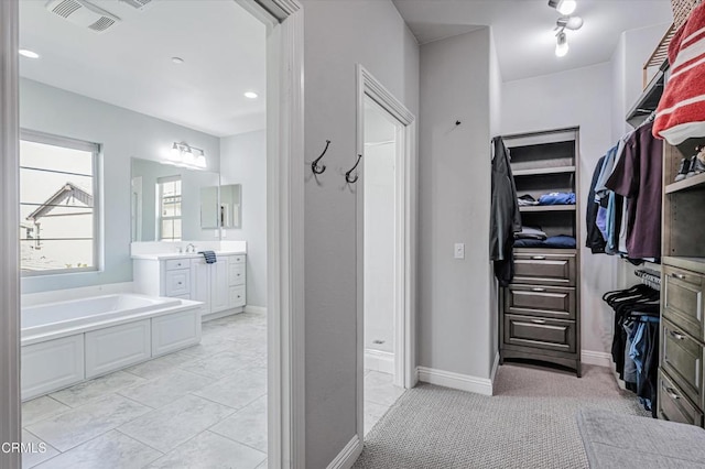 walk in closet featuring visible vents